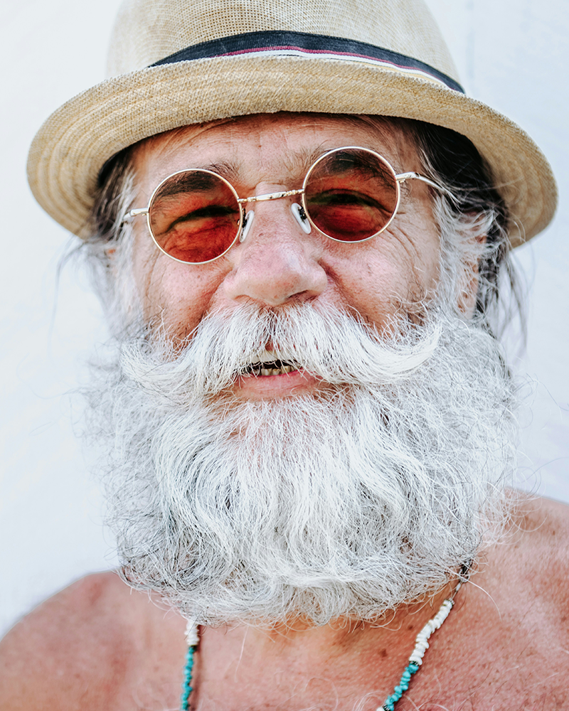 Portrait of an old man at the beach.